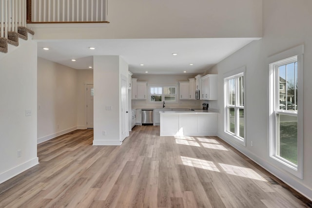 1038 Camden Trl, Greenbrier, TN 37073 - unfurnished living room featuring light wood-style floors, recessed lighting, and baseboards