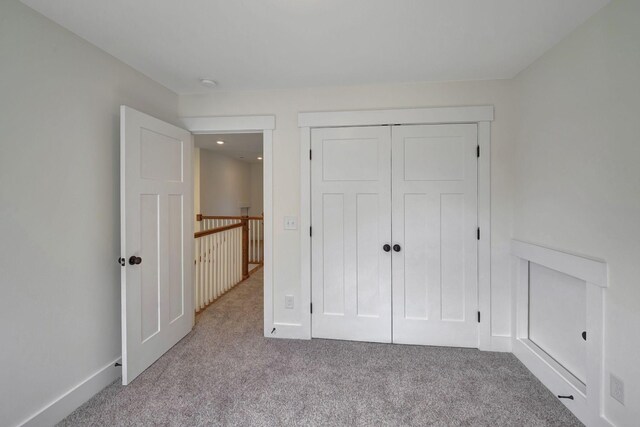1038 Camden Trl, Greenbrier, TN 37073 - unfurnished bedroom featuring carpet floors, a closet, and baseboards