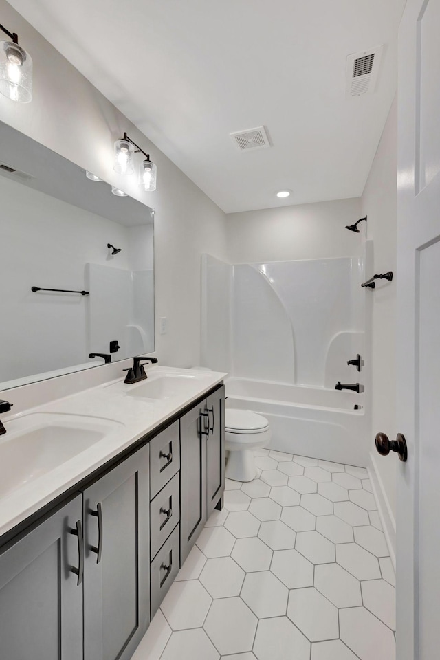 1038 Camden Trl, Greenbrier, TN 37073 - bathroom with double vanity, toilet, bathtub / shower combination, tile patterned floors, and recessed lighting