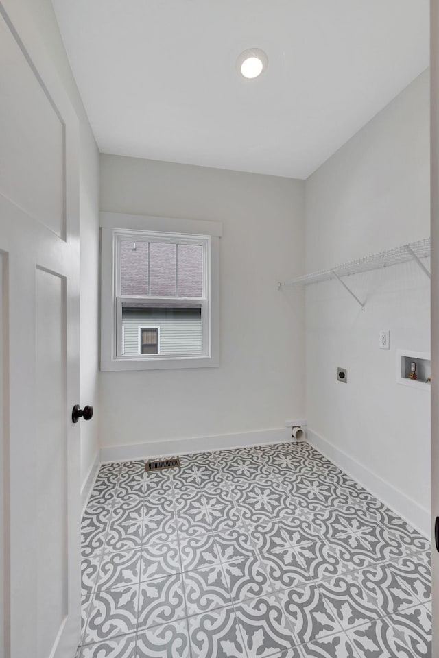 1038 Camden Trl, Greenbrier, TN 37073 - washroom featuring electric dryer hookup, baseboards, and washer hookup