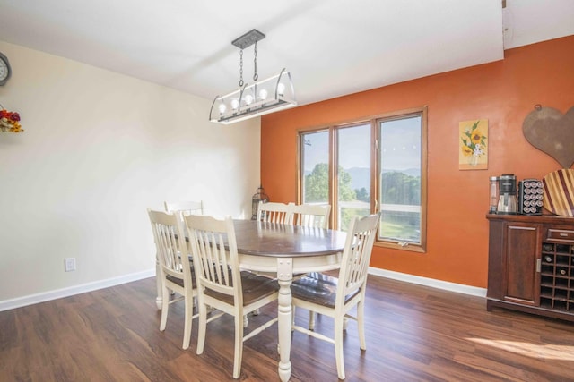 813 Stiner Ln, La Follette, TN 37766 - dining space featuring dark wood-style flooring and baseboards