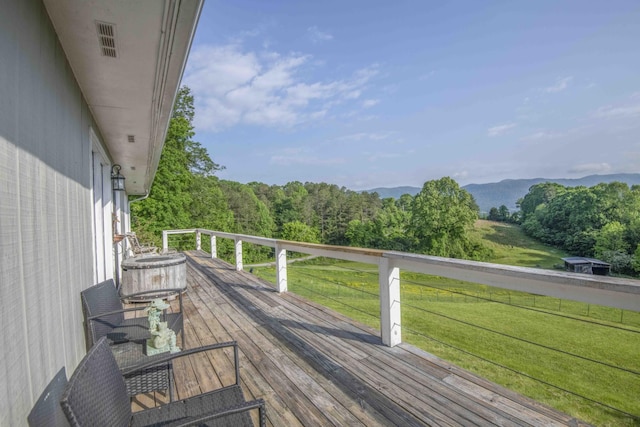 813 Stiner Ln, La Follette, TN 37766 - deck featuring a yard, a wooded view, and a mountain view