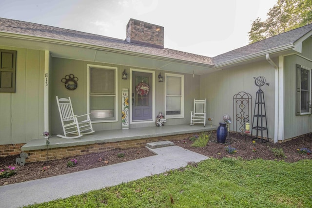 813 Stiner Ln, La Follette, TN 37766 - property entrance with a porch, a chimney, and a shingled roof