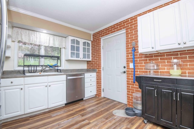 813 Stiner Ln, La Follette, TN 37766 - kitchen featuring dishwasher, ornamental molding, a sink, white cabinets, and wood finished floors