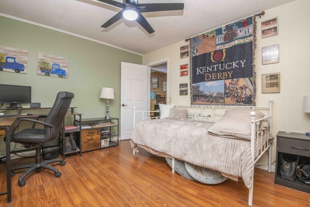 813 Stiner Ln, La Follette, TN 37766 - bedroom featuring wood finished floors, an office area, ornamental molding, and ceiling fan