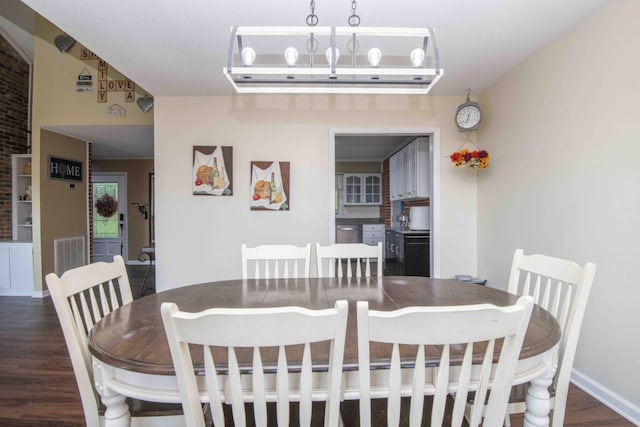 813 Stiner Ln, La Follette, TN 37766 - dining room featuring wood finished floors and baseboards