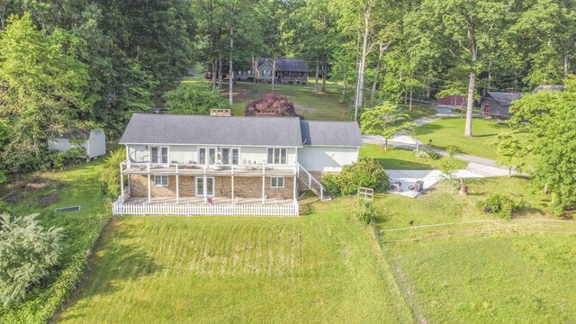 813 Stiner Ln, La Follette, TN 37766 - rear view of property featuring a wooden deck, stairs, a lawn, and a shingled roof