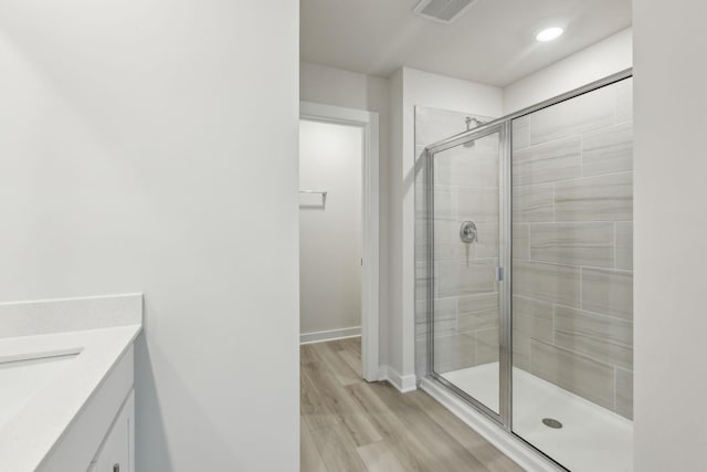 4232 Skyridge Dr, Nashville, TN 37207 - full bath featuring a stall shower, vanity, wood finished floors, baseboards, and recessed lighting