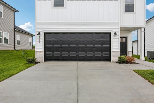 4232 Skyridge Dr, Nashville, TN 37207 - view of front facade with board and batten siding, concrete driveway, a front lawn, a garage, and central AC unit