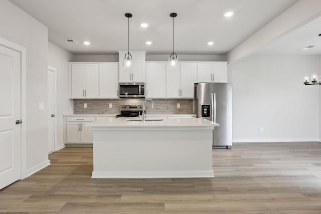 4232 Skyridge Dr, Nashville, TN 37207 - kitchen with stainless steel appliances, a sink, light countertops, tasteful backsplash, and recessed lighting
