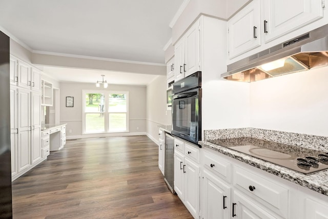 1409 Robert Ln, Cookeville, TN 38506 - kitchen with black oven, under cabinet range hood, white electric cooktop, dark wood-type flooring, and ornamental molding