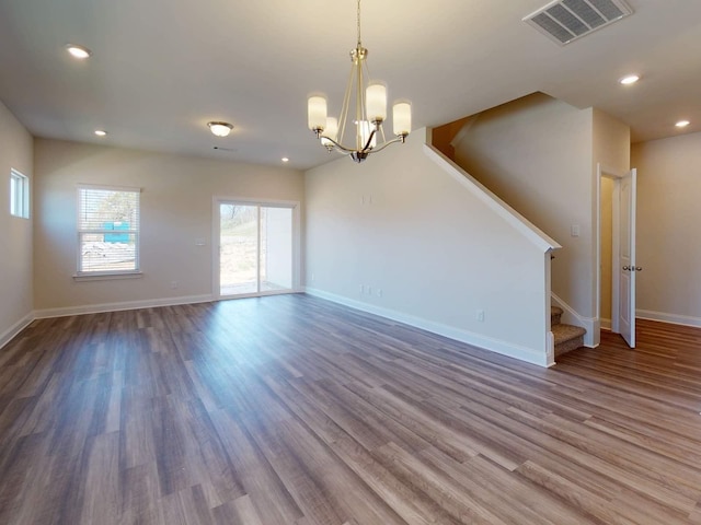 1348 Beasley Blvd, Mount Juliet, TN 37122 - empty room with stairs, a chandelier, wood finished floors, baseboards, and recessed lighting