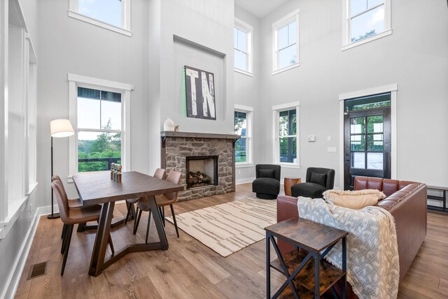 179 Deer Path Ct, Smithville, TN 37166 - living room with a towering ceiling, plenty of natural light, a fireplace, wood finished floors, and baseboards