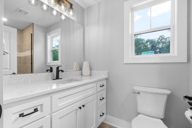 179 Deer Path Ct, Smithville, TN 37166 - bathroom featuring vanity, toilet, baseboards, tile patterned floors, and a tile shower