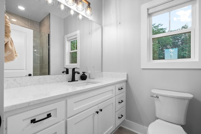 179 Deer Path Ct, Smithville, TN 37166 - full bathroom with vanity, toilet, baseboards, and tiled shower