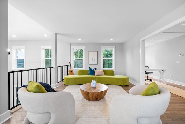 179 Deer Path Ct, Smithville, TN 37166 - living area featuring recessed lighting, healthy amount of natural light, wood finished floors, and baseboards