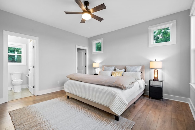179 Deer Path Ct, Smithville, TN 37166 - bedroom featuring multiple windows, hardwood / wood-style flooring, and baseboards