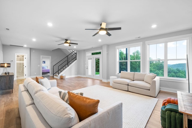 179 Deer Path Ct, Smithville, TN 37166 - living area featuring stairs, a ceiling fan, light wood-style floors, baseboards, and recessed lighting