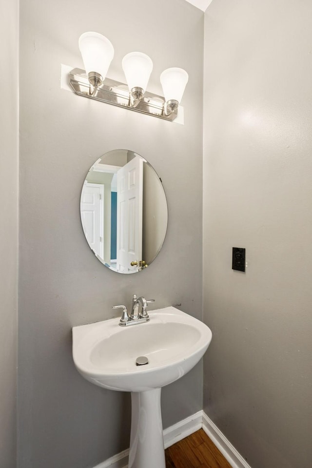 205 Caneel Cv, Hermitage, TN 37076 - bathroom with wood finished floors, baseboards, and a sink