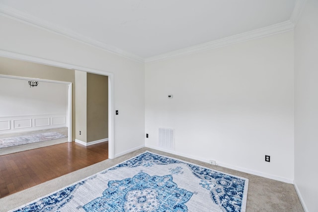205 Caneel Cv, Hermitage, TN 37076 - carpeted empty room featuring ornamental molding, baseboards, and wood finished floors