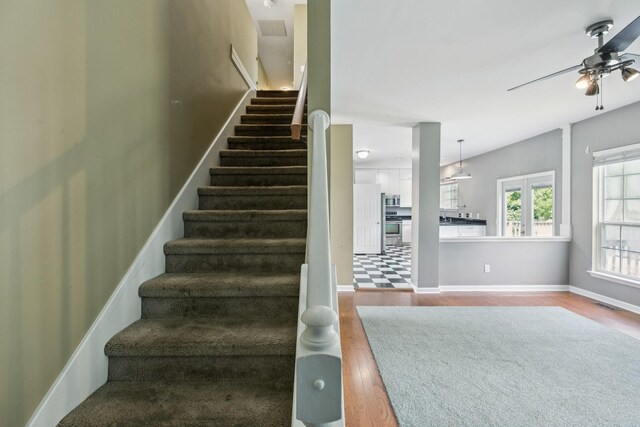 205 Caneel Cv, Hermitage, TN 37076 - stairs with wood finished floors, ceiling fan, and baseboards