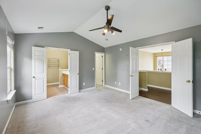 205 Caneel Cv, Hermitage, TN 37076 - unfurnished bedroom featuring light carpet, vaulted ceiling, baseboards, connected bathroom, and a ceiling fan