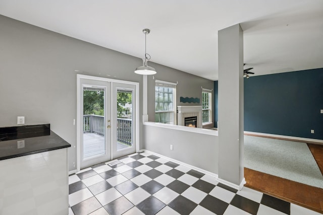 205 Caneel Cv, Hermitage, TN 37076 - unfurnished dining area featuring a ceiling fan, baseboards, tile patterned floors, and a fireplace