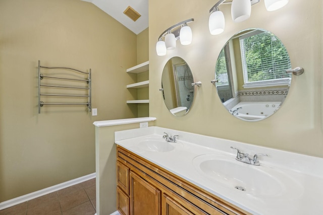 205 Caneel Cv, Hermitage, TN 37076 - full bathroom with tile patterned floors, double vanity, a jetted tub, baseboards, and lofted ceiling