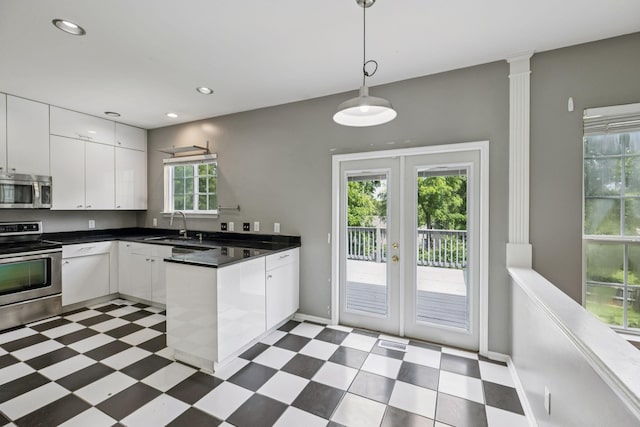 205 Caneel Cv, Hermitage, TN 37076 - kitchen featuring stainless steel appliances, dark flooring, french doors, a sink, and recessed lighting