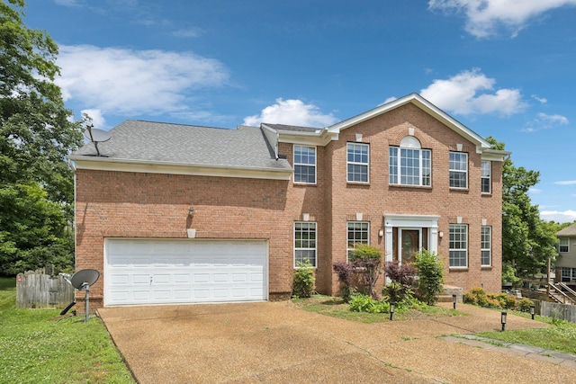 205 Caneel Cv, Hermitage, TN 37076 - colonial inspired home with driveway, brick siding, a shingled roof, and a garage