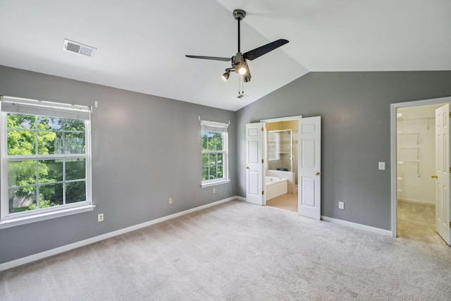 205 Caneel Cv, Hermitage, TN 37076 - unfurnished bedroom with vaulted ceiling, connected bathroom, baseboards, and carpet floors