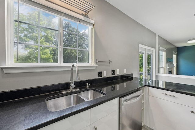 205 Caneel Cv, Hermitage, TN 37076 - kitchen featuring stainless steel dishwasher, a sink, healthy amount of natural light, and white cabinetry