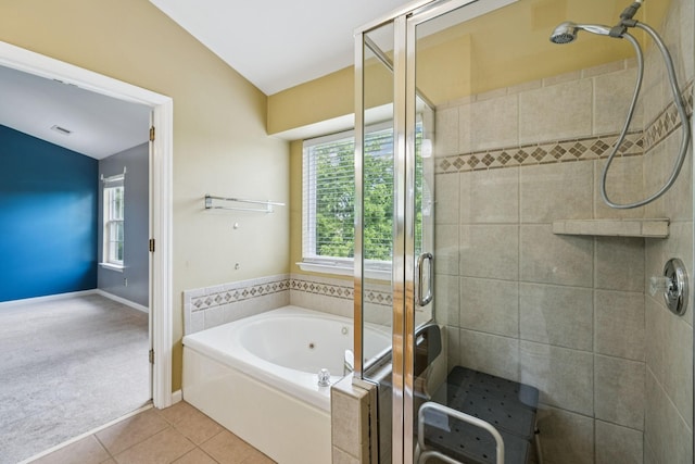 205 Caneel Cv, Hermitage, TN 37076 - full bathroom with a stall shower, a whirlpool tub, tile patterned floors, vaulted ceiling, and baseboards