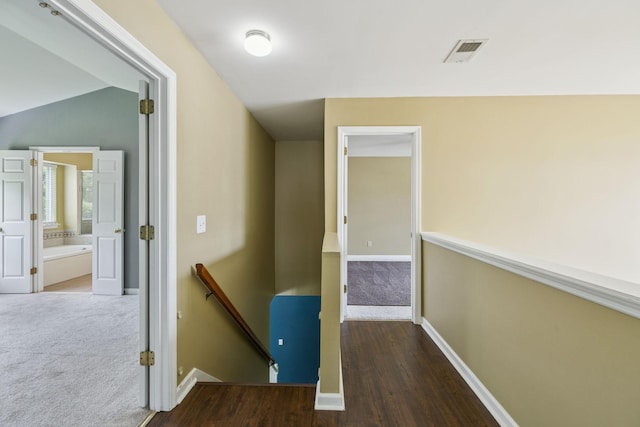 205 Caneel Cv, Hermitage, TN 37076 - hallway with an upstairs landing, carpet, baseboards, and wood finished floors