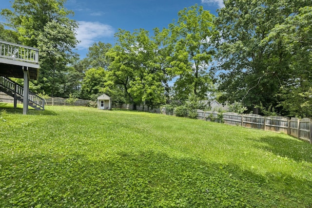 205 Caneel Cv, Hermitage, TN 37076 - view of yard with stairway, view of wooded area, and a deck