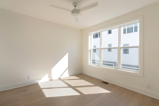 621 Live Life Ln, Nashville, TN 37207 - spare room with baseboards, light wood-style floors, and ceiling fan