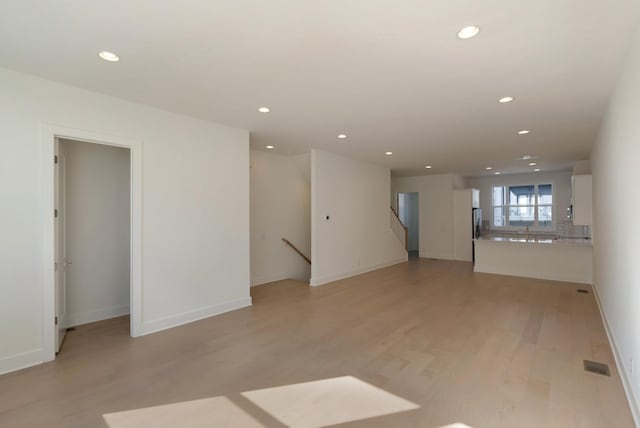 621 Live Life Ln, Nashville, TN 37207 - spare room featuring recessed lighting, light wood-style floors, a sink, and baseboards