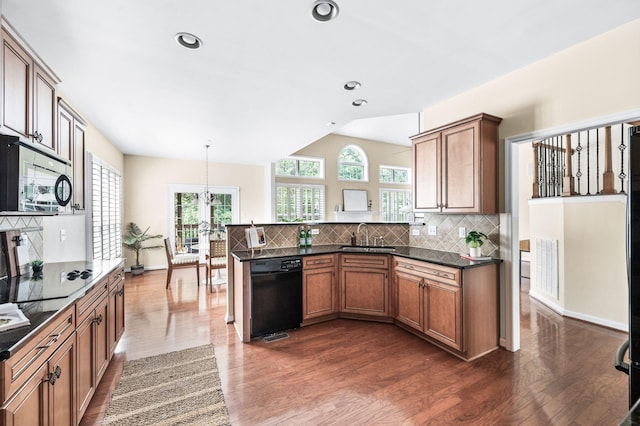 8825 Caswick Ct, Nolensville, TN 37135 - kitchen featuring black appliances, a peninsula, dark wood finished floors, a sink, and recessed lighting
