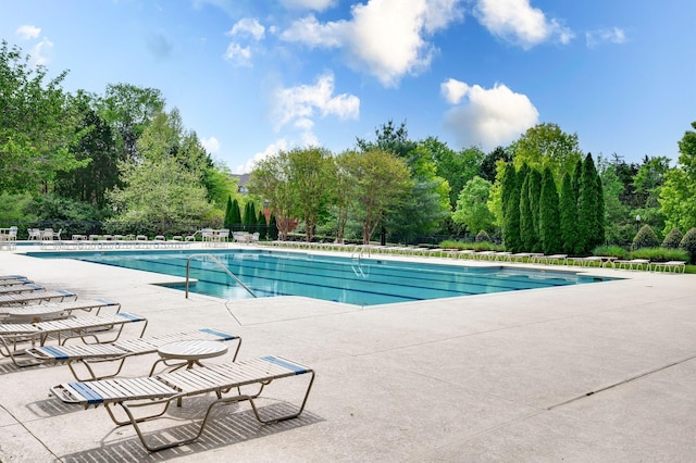 8825 Caswick Ct, Nolensville, TN 37135 - community pool with a patio area and view of wooded area
