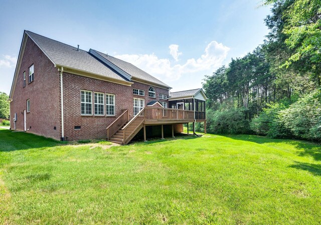 8825 Caswick Ct, Nolensville, TN 37135 - rear view of house featuring a sunroom, brick siding, a deck, stairway, and a lawn