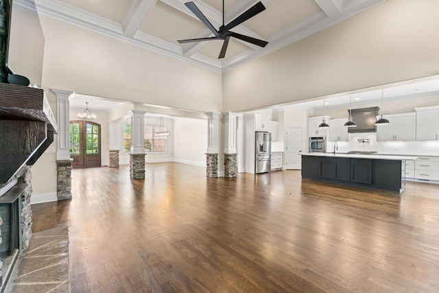 2006 Lynnhaven Ct, Mount Juliet, TN 37122 - unfurnished living room featuring a high ceiling, ceiling fan, crown molding, decorative columns, and coffered ceiling