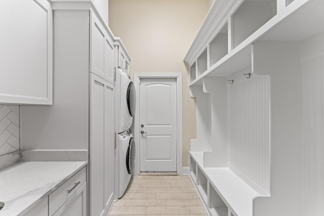 2006 Lynnhaven Ct, Mount Juliet, TN 37122 - laundry room with stacked washer and clothes dryer, light wood finished floors, and cabinet space