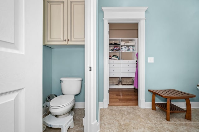 2245 Alexander Blvd, Murfreesboro, TN 37130 - bathroom with toilet, a walk in closet, baseboards, and tile patterned floors