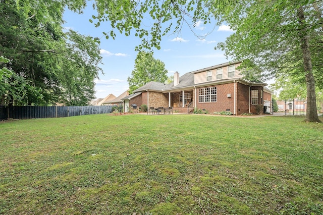 2245 Alexander Blvd, Murfreesboro, TN 37130 - back of property featuring brick siding, a chimney, and a patio