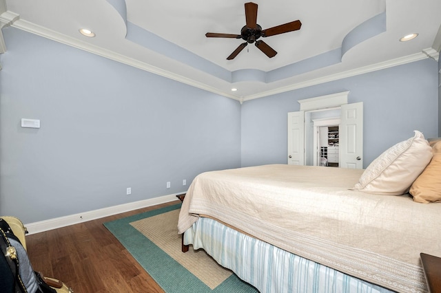 2245 Alexander Blvd, Murfreesboro, TN 37130 - bedroom featuring a tray ceiling, wood finished floors, crown molding, recessed lighting, and a ceiling fan