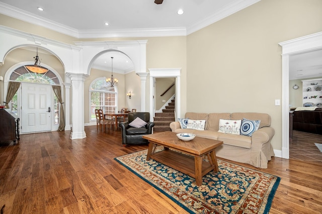 2245 Alexander Blvd, Murfreesboro, TN 37130 - living room with ornate columns, a chandelier, wood finished floors, stairs, and crown molding