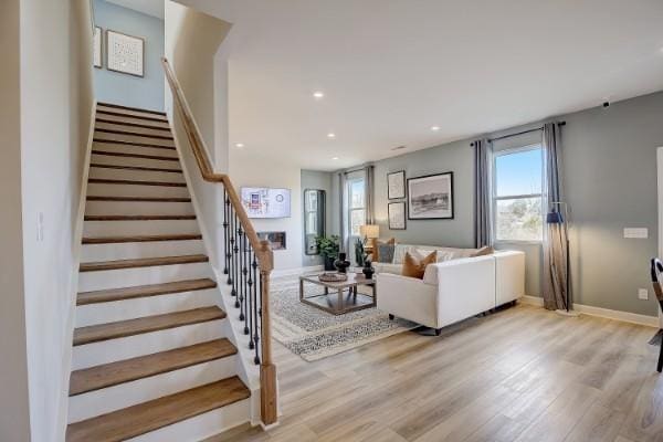 280 Subban Ct, Lebanon, TN 37087 - living room with stairway, light wood-style floors, baseboards, and recessed lighting
