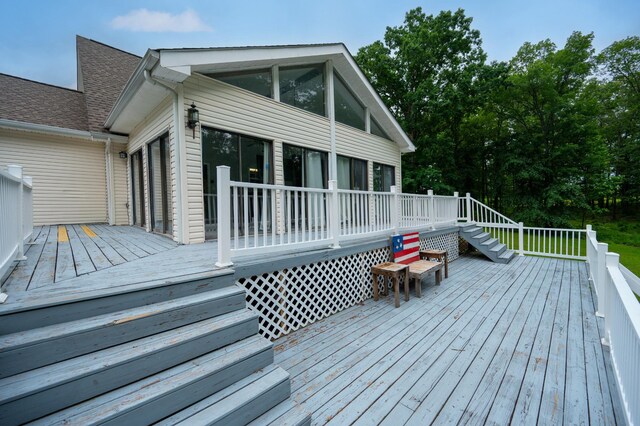 115 Pin Oaks Ln, Hohenwald, TN 38462 - wooden deck with a sunroom and stairs