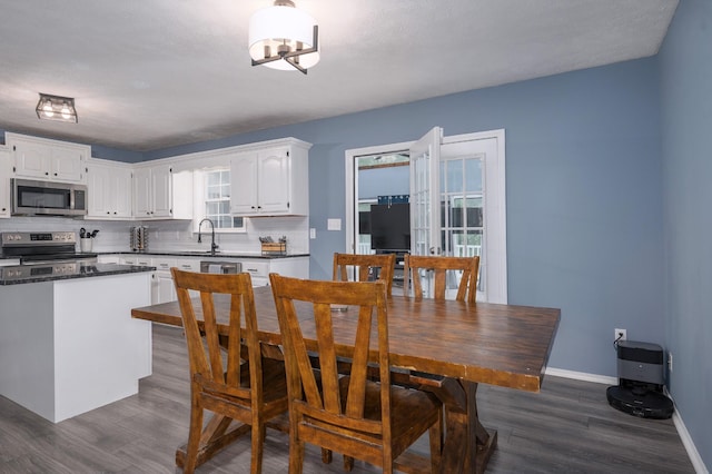 115 Pin Oaks Ln, Hohenwald, TN 38462 - dining room with dark wood-style floors and baseboards