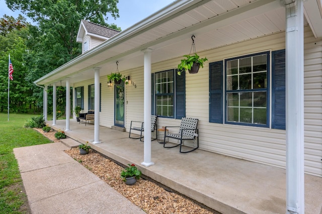 115 Pin Oaks Ln, Hohenwald, TN 38462 - covered porch featuring a yard